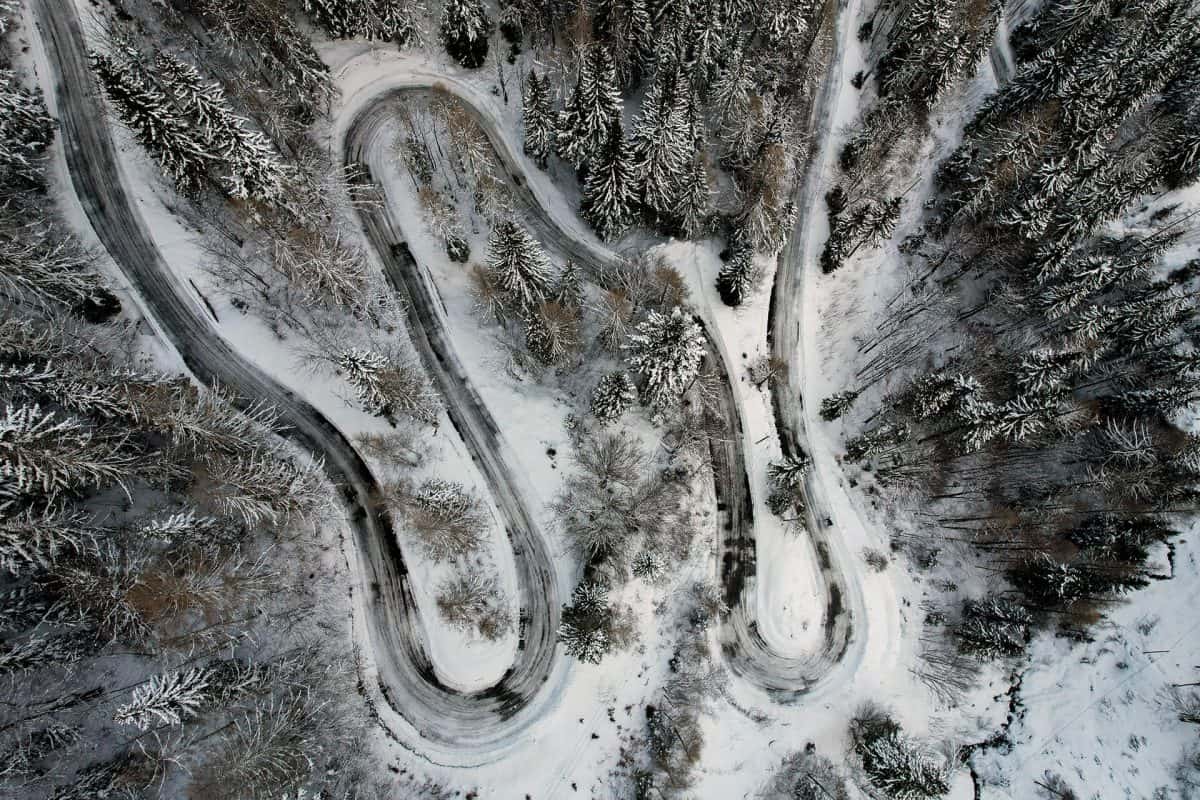 The curves of Russian road in winter from the drone